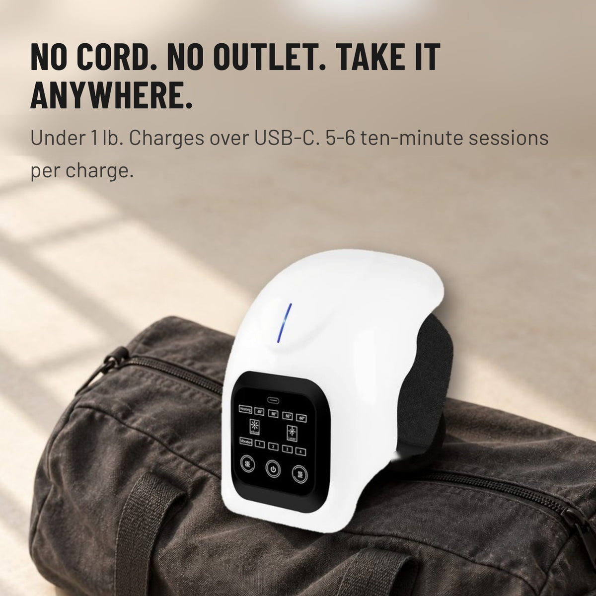 Cordless ShiftReset knee device resting on a gym bag. Under 1 lb, USB-C charging, 5 to 6 ten-minute sessions per charge.